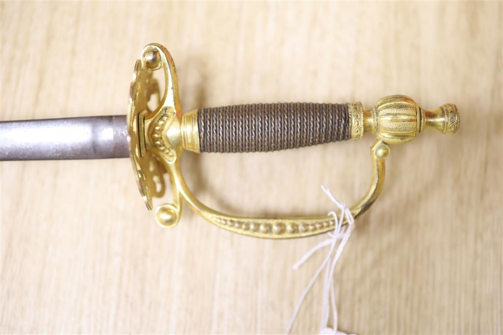 A Victorian dress smallsword, ormolu hilt, pierced and engraved guard, fluted pommel, blade unscrews below hilt,